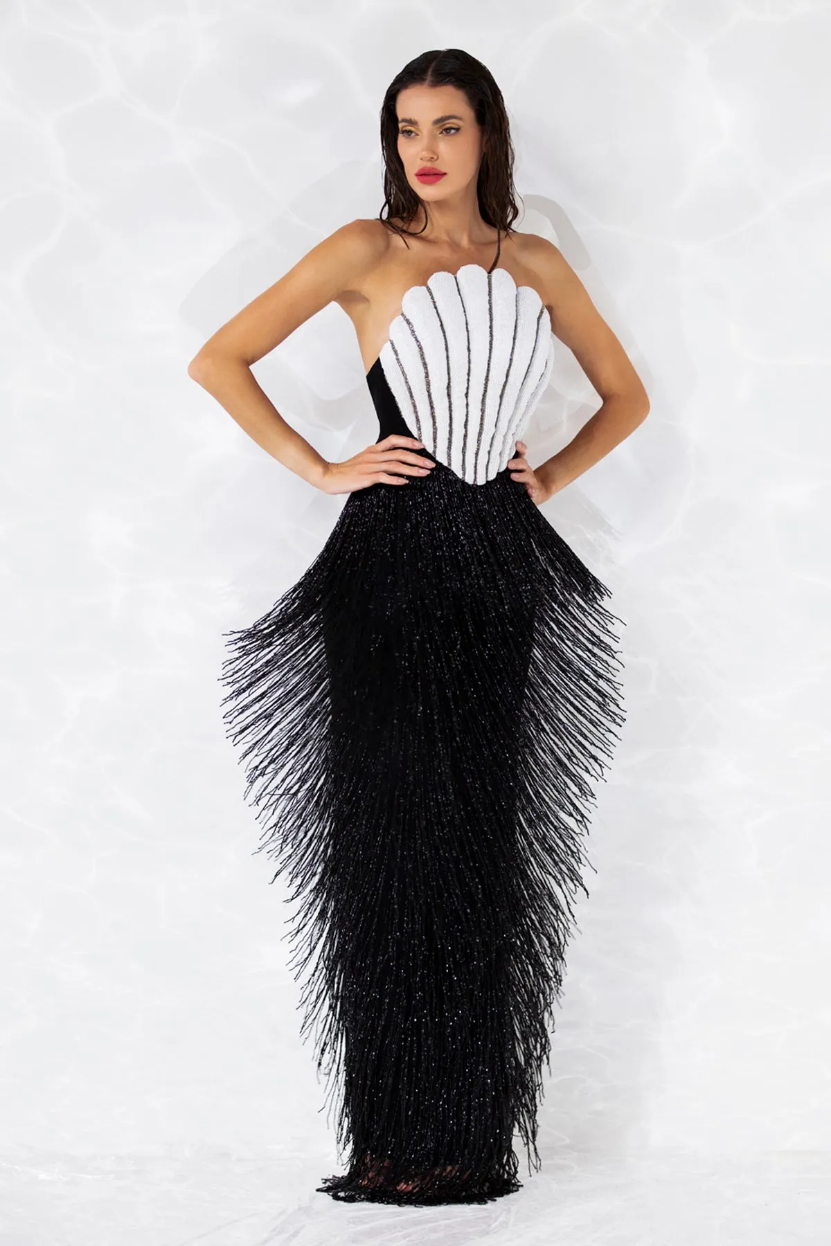 Scallop shell inspired dress consisting of a bustier embroidered with crystals and glass beads, a skirt in hanging beaded fringes